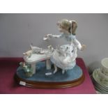 Lladro Figurine, 'Feeding The Kittens' '6109', 19cm high, together with stand.