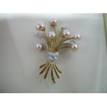 A 9ct Gold Floral Style Brooch, set with freshwater pearls and inset highlights, boxed.