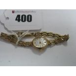 Accurist; A 9ct Gold Cased Ladies Wristwatch, the oval signed dial to 9ct gold gate style bracelet.