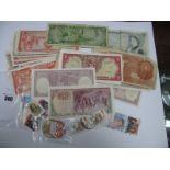 In Excess of Twenty Banknotes, including South American and a £5 note.