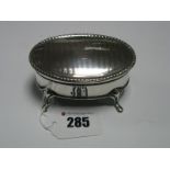 A Hallmarked Silver Oval Trinket Box, with engine turned textured lid, with vacant cartouche, raised