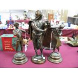 A Pair of Cast Metal Bronzed Figures of Musicians, on circular bases 25cm high. A Larger figure of