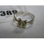 A Modern Single Stone Dress Ring, oval semi set, between tapered shoulders, stamped "750", *Aida