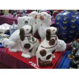 A Pair of XIX Century Staffordshire Pottery Spaniel Dog Ornaments, 31cm high, another single dog and