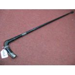 Ebonized Walking Stick, with silver ferrule and handle terminal.