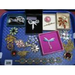 Assorted Costume Brooches, pendants on chains, panel bracelet:- One Tray