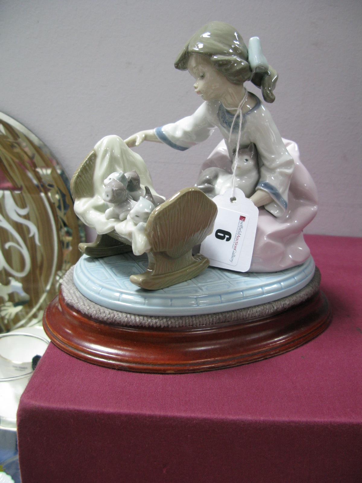 Lladro Figurine, of 'Admiring Kittens in Cradle'. '5784', 14.5cm high, together with stand.