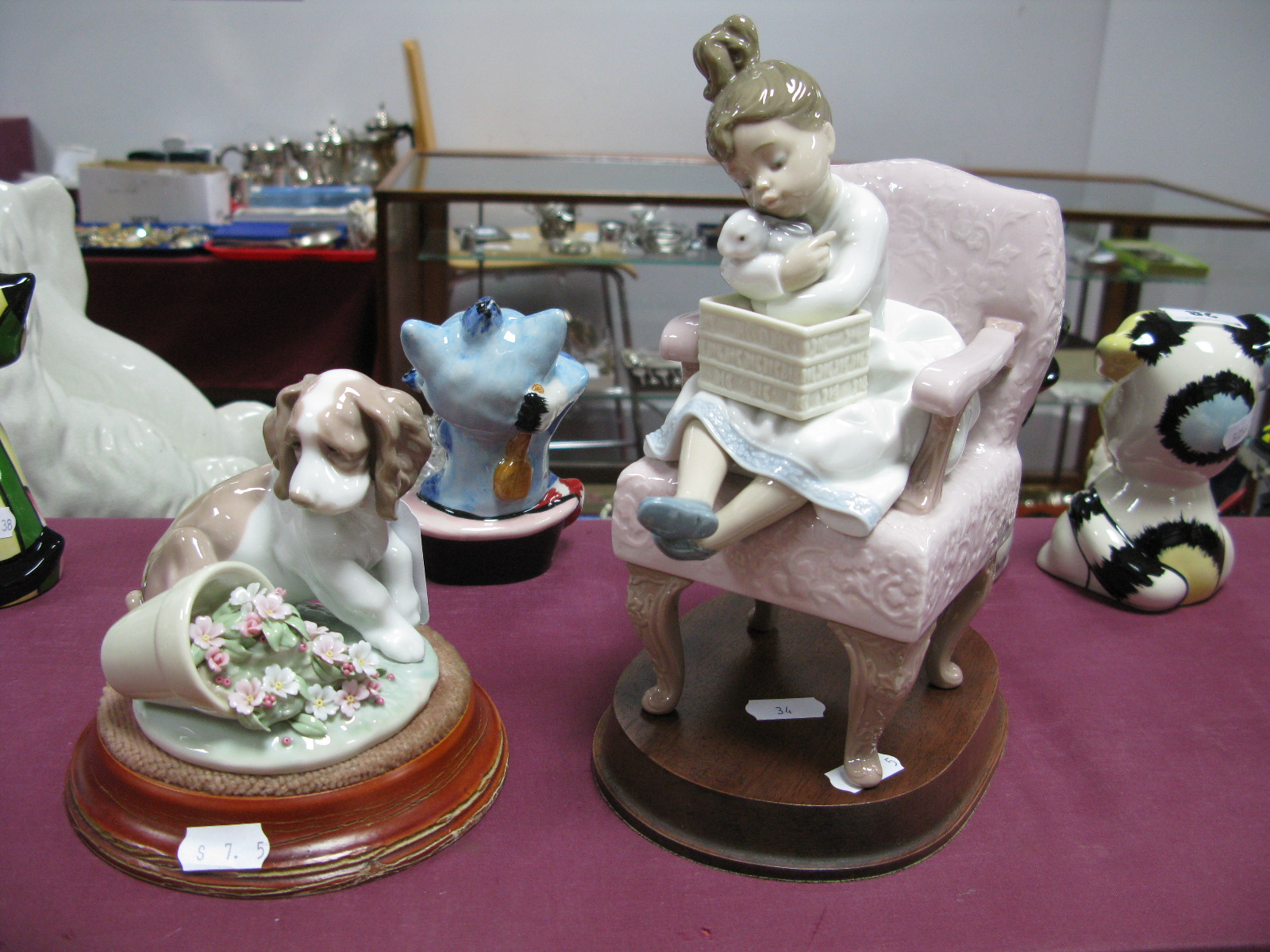 Lladro Figurine of 'Puppy by Spilt Plant Pot', '7672', 9.5cm high, together with stand, another