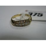 An 18ct Gold Five Stone Diamond Ring, graduated set with old cut stones.