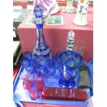 A Blue Flash Glass Decanter and Seven Tots, cranberry beakers, Montana perfume bottle etc:- One