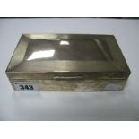 A Hallmarked Silver Cigarette Box, part engine turned, 15.6cm wide.