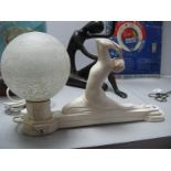 A Mid XX Century Plaster Art Deco Lamp of a lady holding a globe, 39.5cm long.