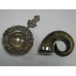 A Continental Tea Strainer, the wide border detailed in relief; A XIX Century horn snuff mull,