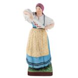 A RUSSIAN PORCELAIN FIGURE OF A DANCING PEASANT WOMAN, GARDNER PORCELAIN FACTORY, LATE 19TH CENTURY