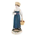 A RUSSIAN PORCELAIN FIGURE OF A PEASANT GIRL WITH A BASKET OF BERRIES, GARDNER PORCELAIN FACTORY