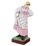 A RUSSIAN PORCELAIN FIGURE OF A DANCING PEASANT WOMAN, GARDNER PORCELAIN FACTORY, LATE 19TH CENTURY