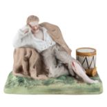 A RUSSIAN PORCELAIN MATCH HOLDER IN THE FORM OF A WOUNDED SOLDIER, GARDNER PORCELAIN FACTORY, 19th C