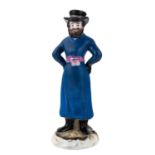 A RUSSIAN PORCELAIN FIGURE OF A COACHMAN, GARDNER PORCELAIN FACTORY, MOSCOW, 1820S-1830S