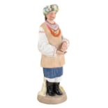 A PORCELAIN FIGURE OF A UKRAINIAN WOMAN, FROM THE "PEOPLE OF RUSSIA" SERIES, GARDNER PORCELAIN