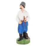 A PORCELAIN FIGURE OF A MALOROSS WITH A PIPE, "PEOPLE OF RUSSIA" SERIES, GARDNER PORCELAIN FACTORY