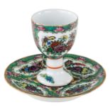 A SMALL GILT PORCELAIN DRINKING CUP AND SAUCER