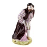 A RUSSIAN PORCELAIN COMMEDIA DELL'ARTE FIGURE OF PANTALONE, GARDNER PORCELAIN FACTORY, MOSCOW, 1830S