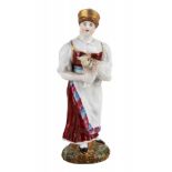 A RUSSIAN PORCELAIN FIGURE OF A YOUNG PEASANT WOMAN WITH A LAMB, PRIVATE PORCELAIN FACTORY