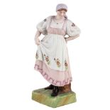 A RUSSIAN PORCELAIN FIGURE OF A DANCING PEASANT WOMAN, GARDNER PORCELAIN FACTORY, LATE 19TH CENTURY