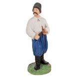 A RUSSIAN PORCELAIN FIGURE OF A MALOROSS WITH A PIPE, FROM THE "PEOPLE OF RUSSIA" SERIES, GARDNER