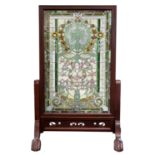 A CONTEMPORARY STAINED GLASS FIRE SCREEN WITH WOODEN FRAME