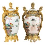 A PAIR OF MONUMENTAL FRENCH ORMOLU-MOUNTED CHINESE FAMILLE VERTE VASES, LIKELY SAMSON & CIE, PARIS