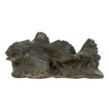 A BRONZE SCULPTURE OF A FISH