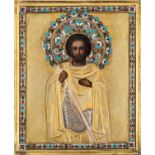 A RUSSIAN ICON OF ST. JOHN THE WARRIOR WITH GILT SILVER AND CLOISONNE ENAMEL OKLAD, 1896-1908