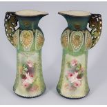 PAIR VICTORIAN PARCEL GILT POLYCHROME EWERS