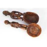 TWO EARLY AFRICAN CARVED FIGURE MOUNTED SPATULAS