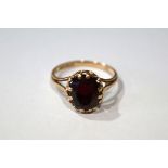 9 CT GOLD AND RUBY LARGE STONE RING