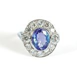 18 CT. WHITE GOLD DIAMOND AND OVAL TANZANITE RING