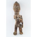 EARLY TWENTIETH-CENTURY AFRICAN CARVED FIGURE