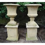 PAIR OF ITALIANATE STONE URNS