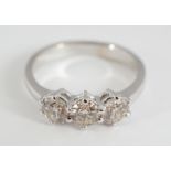 18 CT. WHITE GOLD THREE STONE RING