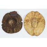 TWO EARLY AFRICAN MOULDED HIDE SHIELDS