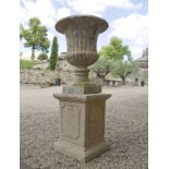 PAIR OF ITALIANATE STONE URNS