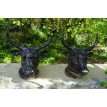 PAIR OF CAST IRON WALL MOUNTED HEADS