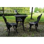CAST IRON PATIO TABLE AND CHAIRS