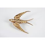 15 CT. GOLD ANTIQUE SEED PEARL SWALLOW BROOCH