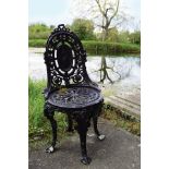 PAIR OF CAST IRON CAMEO BACK CHAIRS