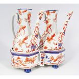 PAIR OF IMARI PATTERN EWERS ON STAND