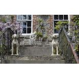 PAIR OF MOULDED STONE DOGS