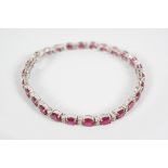 18 CT. WHITE GOLD RUBY AND DIAMOND BRACELET