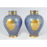 PAIR OF FRENCH PORCELAIN AND PARCEL GILT VASES